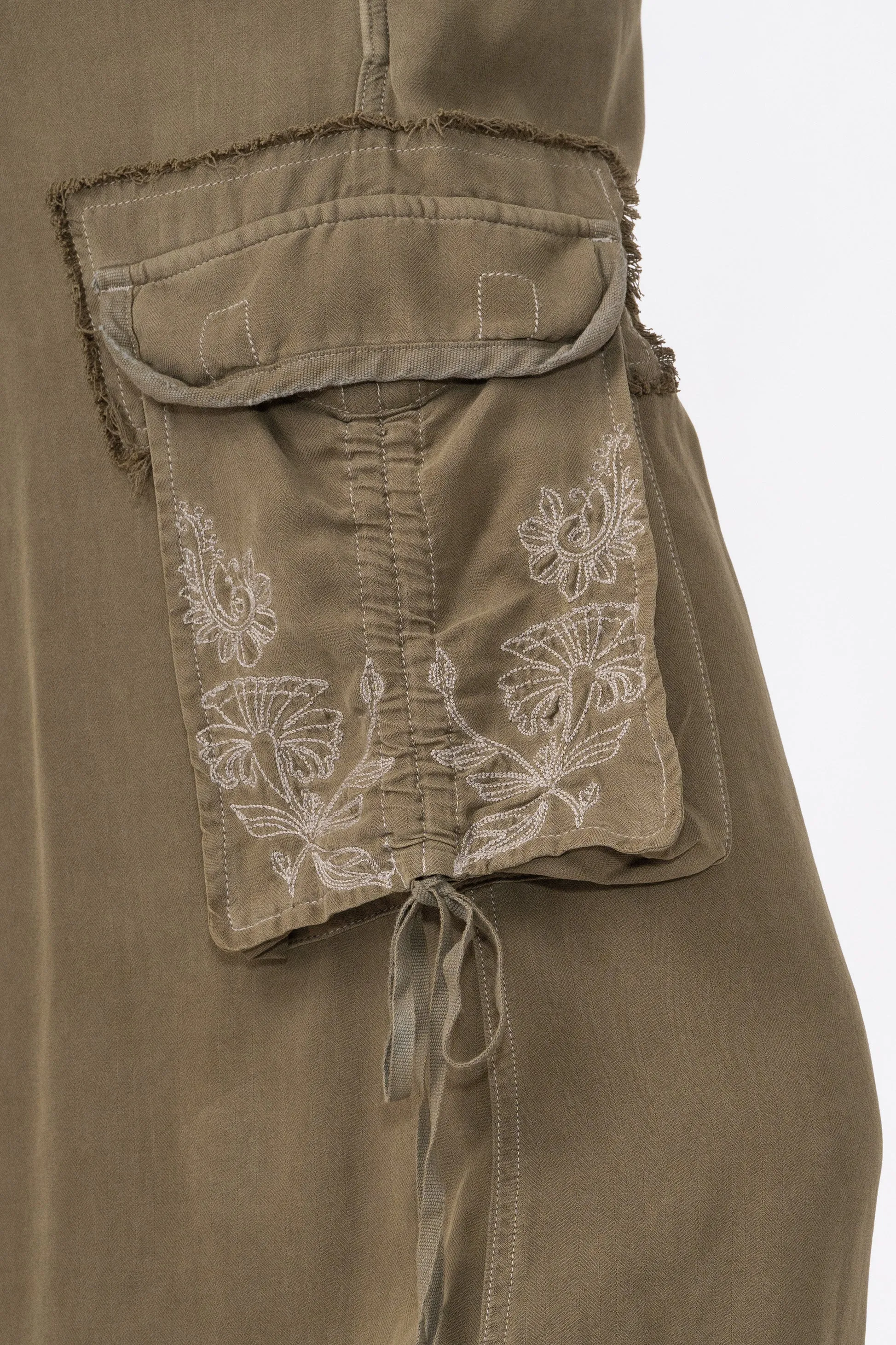 100% Silk asymmetric cargo skirt with embroidery in Olive